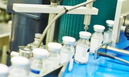 medical vials on a conveyor belt